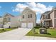 Beautiful home featuring a well-maintained lawn and a double car garage at 2023 Wyndham Pl, Conyers, GA 30013