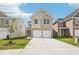 Charming two-story home with a brick facade and a two-car garage at 2023 Wyndham Pl, Conyers, GA 30013