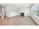 Bright living room features a fireplace and large windows at 2023 Wyndham Pl, Conyers, GA 30013