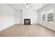 Spacious living room with a modern fireplace and ample natural light at 2023 Wyndham Pl, Conyers, GA 30013