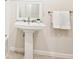 Bathroom with pedestal sink and modern fixtures at 5275 Redfield Ct, Atlanta, GA 30338
