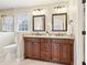 Bathroom with granite countertops, dual sinks, and modern fixtures at 5275 Redfield Ct, Atlanta, GA 30338