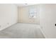 Neutral bedroom with carpet, a window with blinds, and ample space at 5275 Redfield Ct, Atlanta, GA 30338