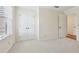 Cozy bedroom with neutral carpet, a window with blinds, and closet space at 5275 Redfield Ct, Atlanta, GA 30338