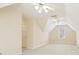 Bright bonus room with cozy carpeting, a ceiling fan, and natural light from the window at 5275 Redfield Ct, Atlanta, GA 30338