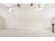 A spacious carpeted bonus room features two ceiling fans and ample lighting, perfect for flexible living at 5275 Redfield Ct, Atlanta, GA 30338