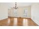 Bright dining room featuring hardwood floors, classic trim, and shuttered windows at 5275 Redfield Ct, Atlanta, GA 30338