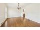 A formal dining room with hardwood floors, crown molding, and large windows at 5275 Redfield Ct, Atlanta, GA 30338