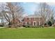 Charming brick two-story home with manicured front lawn and mature trees at 5275 Redfield Ct, Atlanta, GA 30338