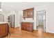 Well-appointed kitchen with wood floors, custom cabinets, granite counters, and stainless appliances at 5275 Redfield Ct, Atlanta, GA 30338