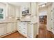 Well-lit kitchen featuring wooden cabinets, stainless steel appliances, and granite countertops at 5275 Redfield Ct, Atlanta, GA 30338