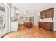 Bright kitchen with wood floors, center island, stainless steel appliances, and custom cabinetry at 5275 Redfield Ct, Atlanta, GA 30338