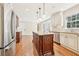 Kitchen with stainless appliances, granite counters, kitchen island, and light cabinets at 5275 Redfield Ct, Atlanta, GA 30338