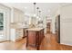 Elegant kitchen featuring a center island, stainless steel appliances, and custom cabinets at 5275 Redfield Ct, Atlanta, GA 30338