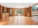 Spacious living room with hardwood floors, a fireplace, and built-in bookshelves at 5275 Redfield Ct, Atlanta, GA 30338