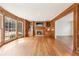 Large living room with hardwood floors, built-in shelves, fireplace and sun-drenched windows at 5275 Redfield Ct, Atlanta, GA 30338