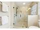 Walk-in shower with glass door and tile surround at 5275 Redfield Ct, Atlanta, GA 30338