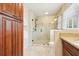 Spacious shower with glass door and tile surround at 5275 Redfield Ct, Atlanta, GA 30338
