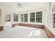 Bright sunroom featuring large windows, brick accents, and a door to the outdoors at 5275 Redfield Ct, Atlanta, GA 30338