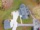 An aerial view showing the house, the detached garage, and spacious lot at 935 Old Loganville Rd, Loganville, GA 30052