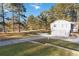 A detached two-car garage with long driveway and plenty of parking space at 935 Old Loganville Rd, Loganville, GA 30052