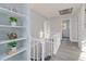 Charming hallway featuring freshly painted walls, modern flooring, and built-in shelving at 935 Old Loganville Rd, Loganville, GA 30052