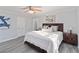 Relaxing bedroom with a large bed, wood furniture, and natural light at 935 Old Loganville Rd, Loganville, GA 30052