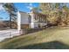 A side view of this beautiful home with its screened-in porch at 935 Old Loganville Rd, Loganville, GA 30052