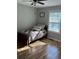 Cozy bedroom with hardwood floors, natural lighting, and a comfortable bed at 1677 Grey Fox Ct, Lawrenceville, GA 30044