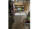 Functional laundry area with a washer, dryer, and shelving for storage and organization at 1677 Grey Fox Ct, Lawrenceville, GA 30044