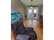 Cozy living room with a recliner, an aquarium, and a view of the outdoor patio at 1677 Grey Fox Ct, Lawrenceville, GA 30044