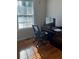 Home office with a desk, chair, and natural light from the window at 1677 Grey Fox Ct, Lawrenceville, GA 30044