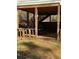 Spacious deck with wooden beams and a lawnmower, enhancing outdoor living at 1677 Grey Fox Ct, Lawrenceville, GA 30044