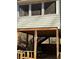View of the deck with wooden support beams and stairs, providing additional outdoor space at 1677 Grey Fox Ct, Lawrenceville, GA 30044