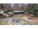 Expansive backyard featuring a deck, firepit area, playground, and storage shed at 181 Pinehurst Ln, Marietta, GA 30068