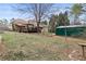Exterior of home with deck, storage shed, green lawn, and swing set at 181 Pinehurst Ln, Marietta, GA 30068
