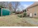 Exterior view of backyard with shed, back of house, and well maintained lawn at 181 Pinehurst Ln, Marietta, GA 30068