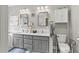 Bathroom featuring double vanity, stylish mirrors, and ample storage at 181 Pinehurst Ln, Marietta, GA 30068
