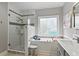Bathroom featuring a glass enclosed shower, soaking tub, and vanity sink at 181 Pinehurst Ln, Marietta, GA 30068