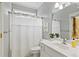 Cozy bathroom featuring a shower-tub combo, vanity, and natural light at 181 Pinehurst Ln, Marietta, GA 30068