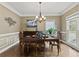 Elegant dining room with a chandelier, crown molding, and natural light at 181 Pinehurst Ln, Marietta, GA 30068