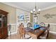 Charming dining room displaying crown molding and a view into the beautifully decorated living room at 181 Pinehurst Ln, Marietta, GA 30068