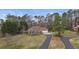 View of a beautiful single-story home with an attached two-car garage and a long driveway at 181 Pinehurst Ln, Marietta, GA 30068