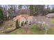 Exterior shot of a single-story home with a well-maintained lawn and mature trees at 181 Pinehurst Ln, Marietta, GA 30068