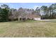 Charming single-story home with a well-manicured lawn, complemented by a two-car garage at 181 Pinehurst Ln, Marietta, GA 30068