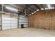 Spacious garage or storage shed with metal framing and an overhead door at 181 Pinehurst Ln, Marietta, GA 30068