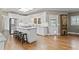Bright kitchen with white cabinetry, granite countertops, and an island with seating at 181 Pinehurst Ln, Marietta, GA 30068