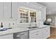 Close-up of kitchen with white cabinets, granite countertops, stainless steel appliances and subway tile backsplash at 181 Pinehurst Ln, Marietta, GA 30068