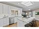Open kitchen with white cabinets, granite countertops, stainless steel appliances and island with bar stool seating at 181 Pinehurst Ln, Marietta, GA 30068