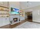 Inviting living room with a fireplace, built-in shelving, and hardwood floors at 181 Pinehurst Ln, Marietta, GA 30068